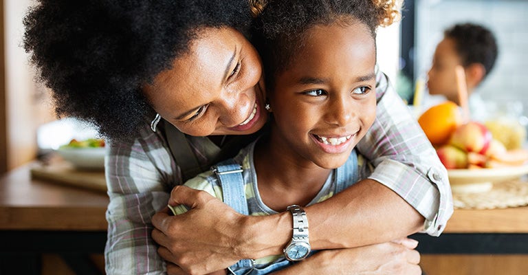 Portrait of a Small Family of a Mother, a Son and a Grandfather Watching TV Together in the Living Room. Family Generations Connecting and Bonding by Spending Time Together, Discussing and Having Fun