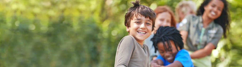 A group of kids in a tug-of-war game